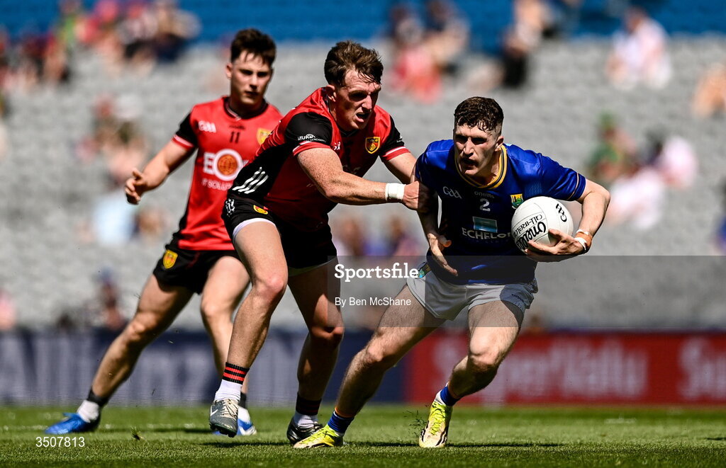 11 July 2026; Tom Moran of Wicklow is tackled by Miceal Rooney of Down during the Tailteann Cup final match between Down and Wicklow at Croke Park in Dublin. Photo by Ben McShane/Sportsfile