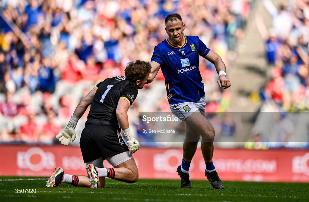 11 July 2026; Dean Healy of Wicklow collides with Down goalkeeper Ronan Burns after scoring his side's first goal during the Tailteann Cup final match between Down and Wicklow at Croke Park in Dublin. Photo by Ben McShane/Sportsfile