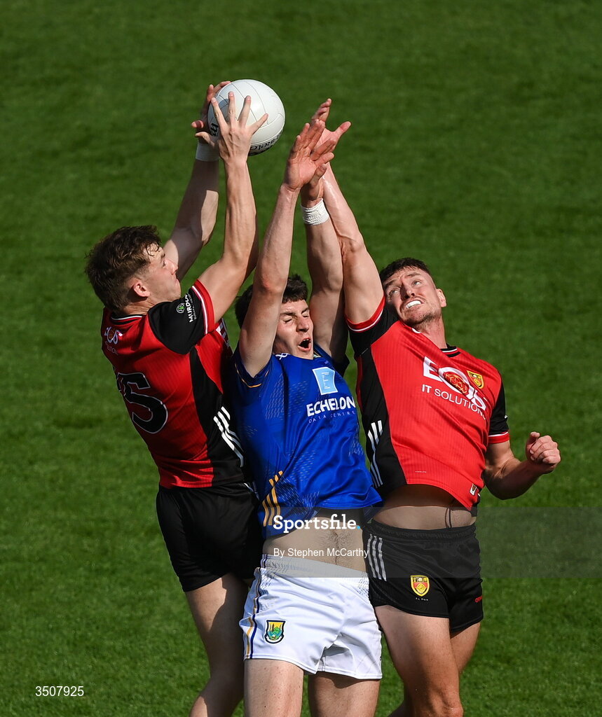 11 July 2026; Jack Kirwan of Wicklow in action against Eamon Brown, left, and Caolan Mooney of Down during the Tailteann Cup final match between Down and Wicklow at Croke Park in Dublin. Photo by Stephen McCarthy/Sportsfile