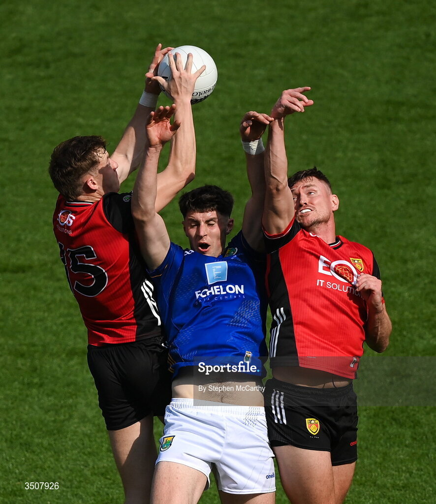 11 July 2026; Jack Kirwan of Wicklow in action against Eamon Brown, left, and Caolan Mooney of Down during the Tailteann Cup final match between Down and Wicklow at Croke Park in Dublin. Photo by Stephen McCarthy/Sportsfile