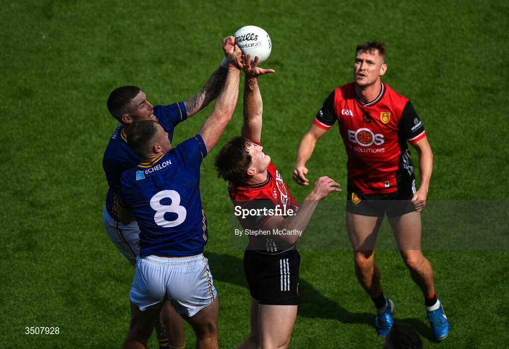 11 July 2026; Odhran Murdock of Down in action against Dean Healy, 8, and Jonathan Carlin of Wicklow during the Tailteann Cup final match between Down and Wicklow at Croke Park in Dublin. Photo by Stephen McCarthy/Sportsfile