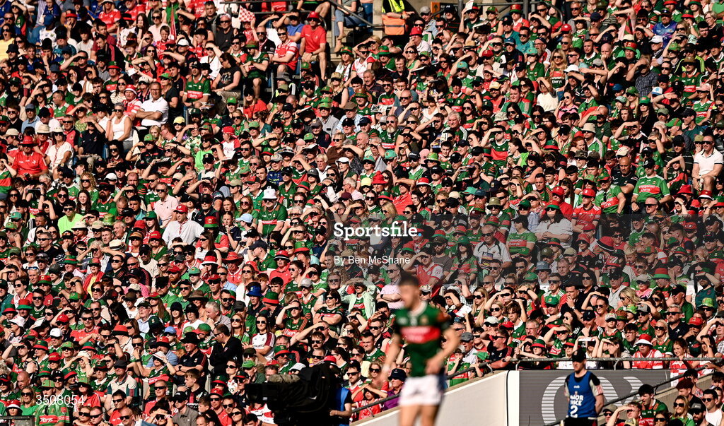 11 July 2026; Supporters shield their eyes from the evening sun during the GAA Football All-Ireland Senior Championship semi-final match between Mayo and Louth at Croke Park in Dublin. Photo by Ben McShane/Sportsfile