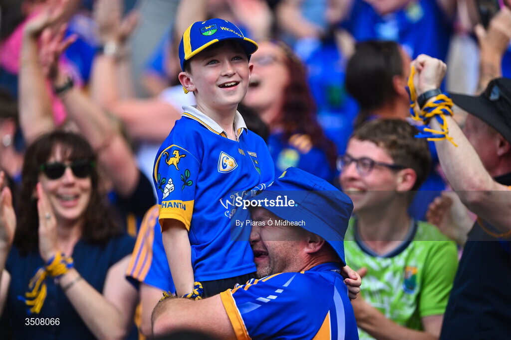 11 July 2026; Wicklow supporter Mick Kelly, from Kiltegan, embraces his son Michael Anthony, age 10, at the final whistle after victory in the Tailteann Cup final match between Down and Wicklow at Croke Park in Dublin. Photo by Piaras Ó Mídheach/Sportsfile