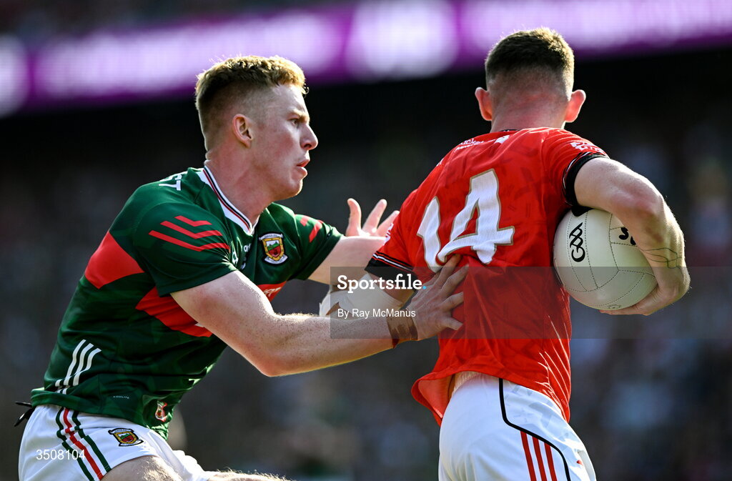 11 July 2026; Ciaran Downey of Louth is tackled by David McBrien of Mayo during the GAA Football All-Ireland Senior Championship semi-final match between Mayo and Louth at Croke Park in Dublin. Photo by Ray McManus/Sportsfile