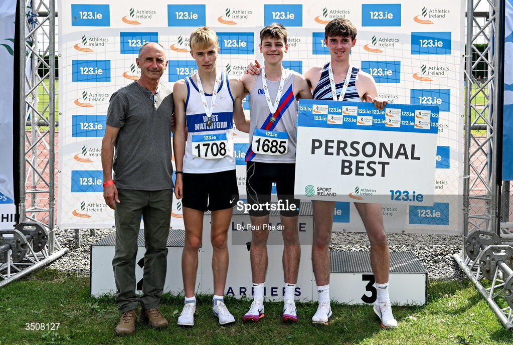 11 July 2026; Ewan Kennedy of Dundrum South Dublin A.C., third from left, in first, Noah Commins of West Waterford A.C., second from left, in second, Alex Downey of Lagan Valley A.C., right, in third, alongside Olympian Marcus O'Sullivan after the U18 boy's 1500m during day three of the 123.ie National Championships at Tullamore Harriers Athletics Club in Tullamore, Offaly. Photo by Paul Phelan/Sportsfile