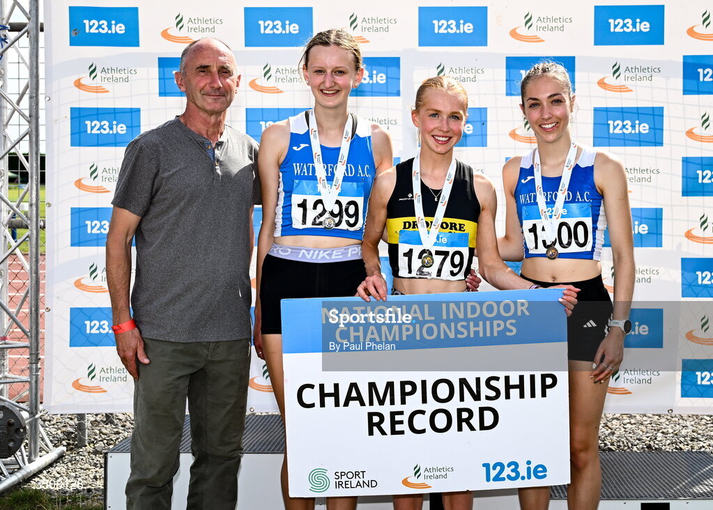 11 July 2026; Emma Stewart of Dromore A.C. third from left, in first with a championship record time of 4:30.62, Ciara Rohan of Waterford A.C., second from left, in second, Lucy Clinton of Waterford A.C., right, in third, alongside Olympian Marcus O'Sullivan after the U18 girl's 1500m during day three of the 123.ie National Championships at Tullamore Harriers Athletics Club in Tullamore, Offaly. Photo by Paul Phelan/Sportsfile