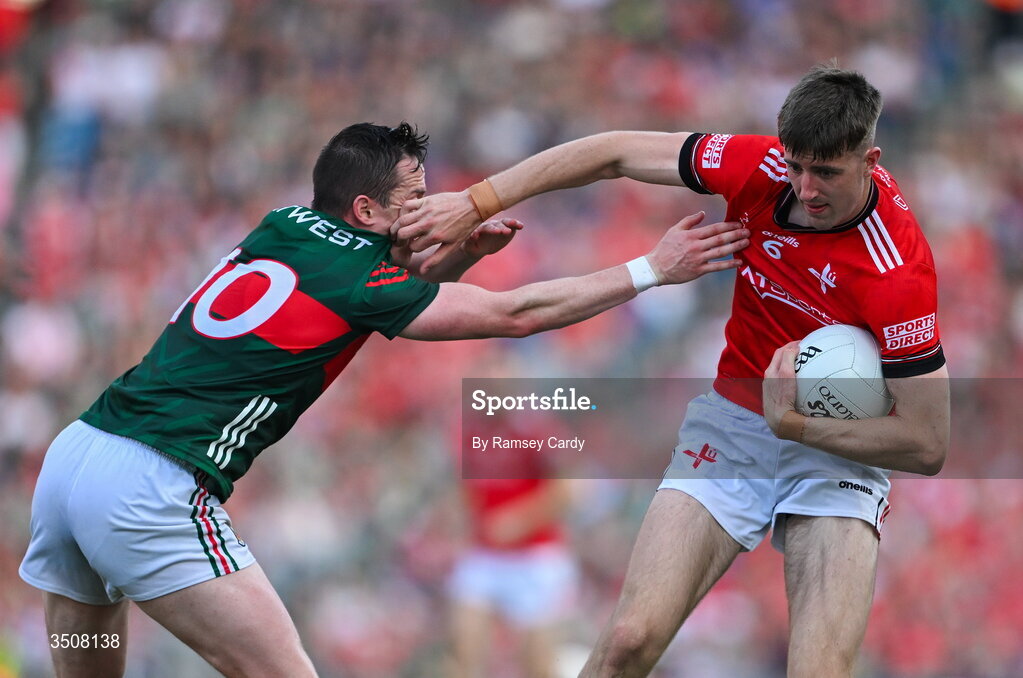 11 July 2026; Dara McDonnell of Louth in action against Stephen Coen of Mayo during the GAA Football All-Ireland Senior Championship semi-final match between Mayo and Louth at Croke Park in Dublin. Photo by Ramsey Cardy/Sportsfile