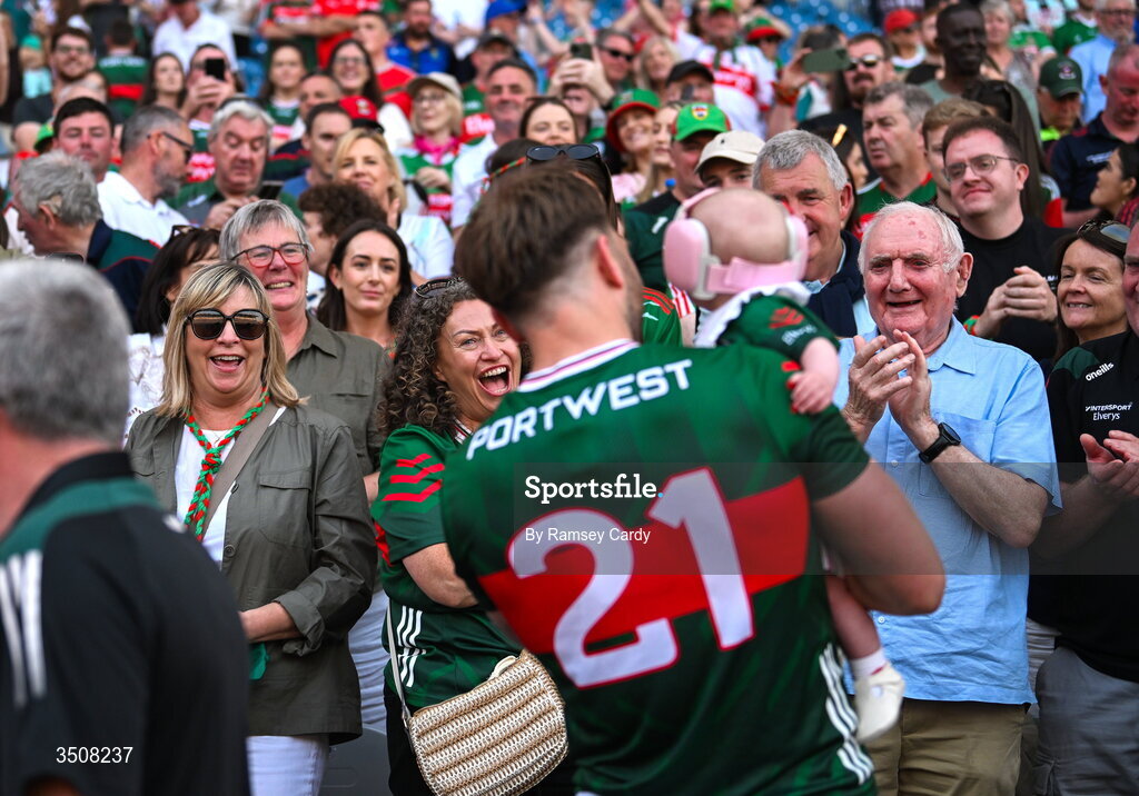 11 July 2026; Supporters watch on as Aidan O'Shea of Mayo celebrates with his daughter Romee after the GAA Football All-Ireland Senior Championship semi-final match between Mayo and Louth at Croke Park in Dublin. Photo by Ramsey Cardy/Sportsfile