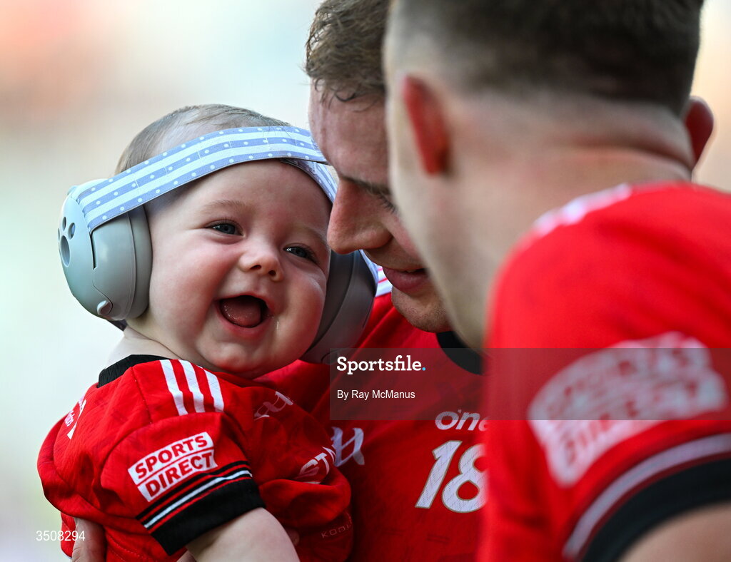 11 July 2026; Five month old Conan Byrne with her dad Ciaran Byrne and his team mate Ryan Burns of Louth after the GAA Football All-Ireland Senior Championship semi-final match between Mayo and Louth at Croke Park in Dublin. Photo by Ray McManus/Sportsfile