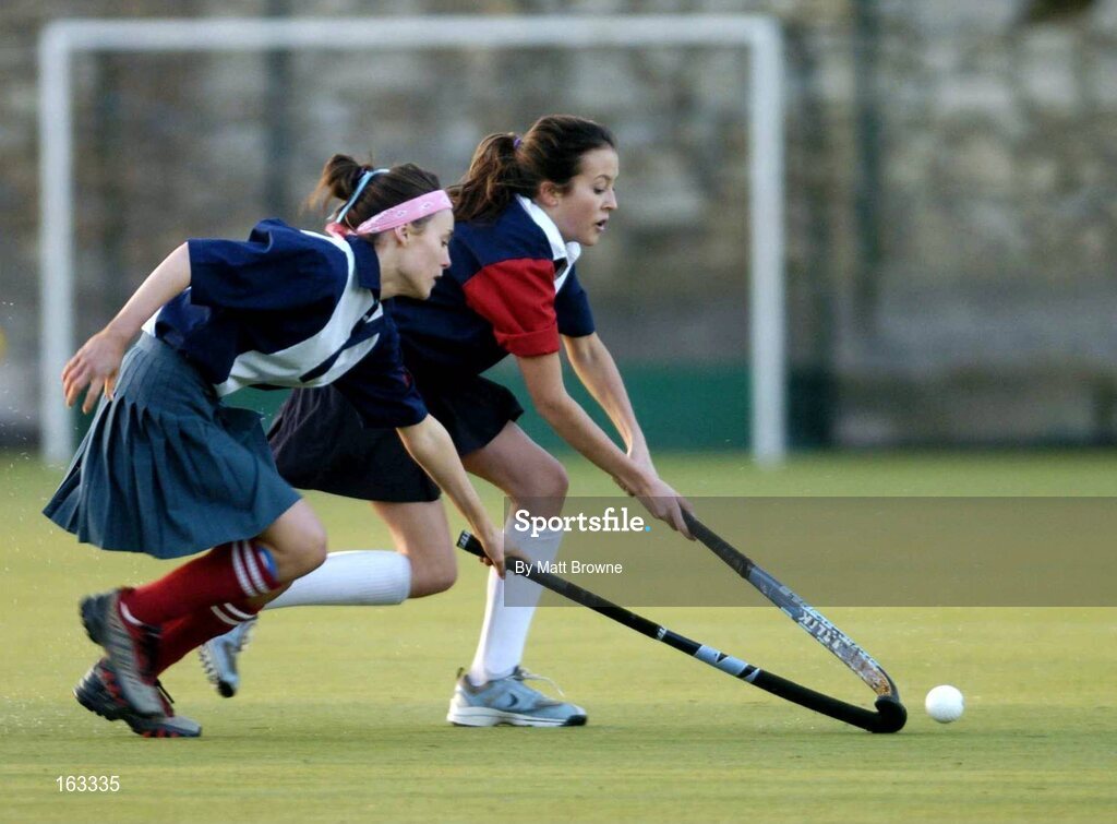 17 December 2004; Jane Latham, right, Wesley College, is tackled by Juliett Gilligan, Mount Anville. Schoolgirls Leinster Premier League, Mount Anville v Wesley College, Grange Road, Dublin. Picture credit; Matt Browne / SPORTSFILE