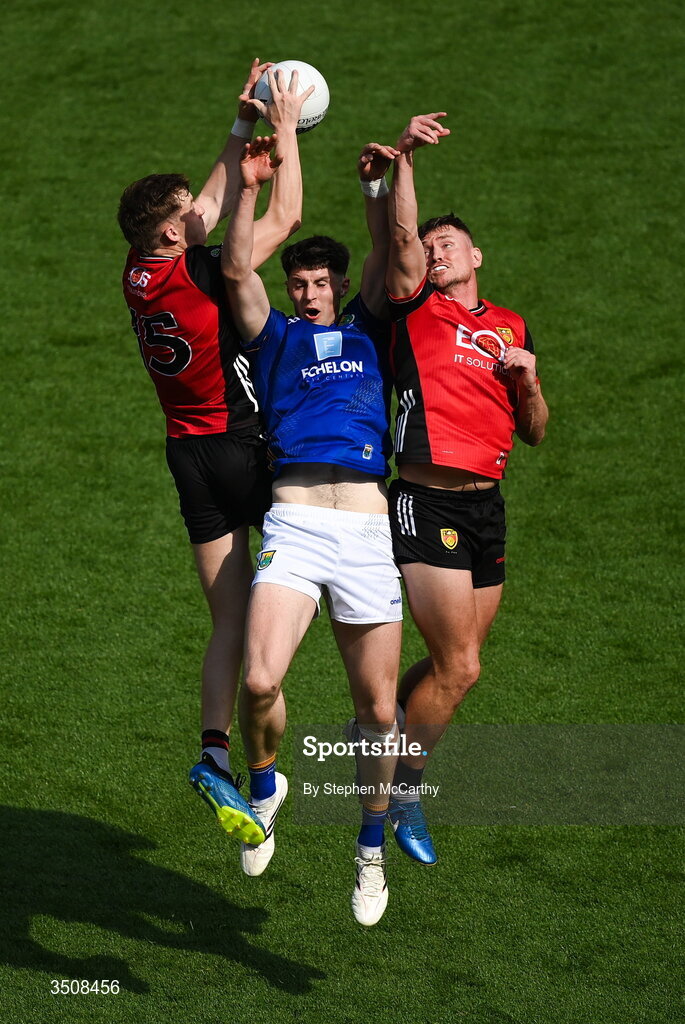 11 July 2026; Jack Kirwan of Wicklow in action against Eamon Brown, left, and Caolan Mooney of Down during the Tailteann Cup final match between Down and Wicklow at Croke Park in Dublin.  Photo by Stephen McCarthy/Sportsfile