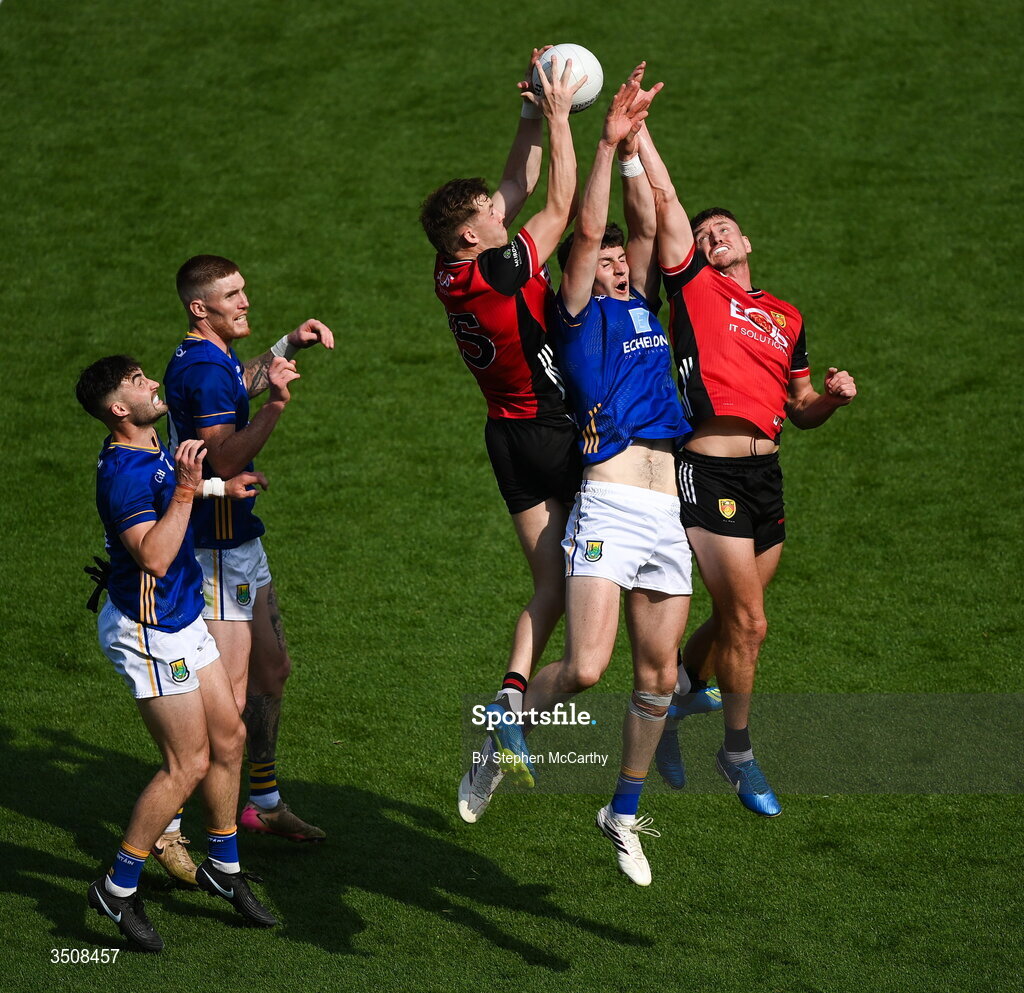 11 July 2026; Jack Kirwan of Wicklow in action against Eamon Brown, left, and Caolan Mooney of Down during the Tailteann Cup final match between Down and Wicklow at Croke Park in Dublin.  Photo by Stephen McCarthy/Sportsfile