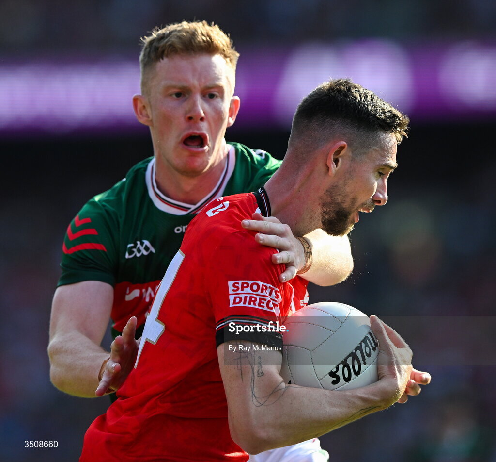 11 July 2026; Ciaran Downey of Louth is tackled by David McBrien of Mayo during the GAA Football All-Ireland Senior Championship semi-final match between Mayo and Louth at Croke Park in Dublin. Photo by Ray McManus/Sportsfile