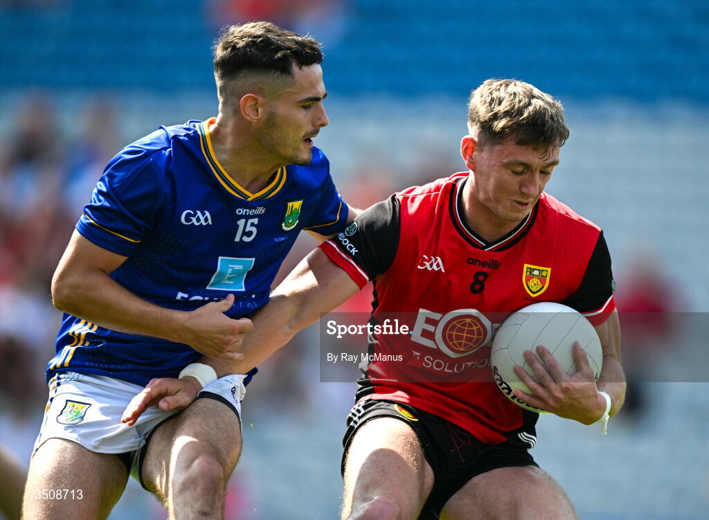 11 July 2026; Ryan McEvoy of Down is tackled by Ryan Burns of Louth during the Tailteann Cup final match between Down and Wicklow at Croke Park in Dublin. Photo by Ray McManus/Sportsfile