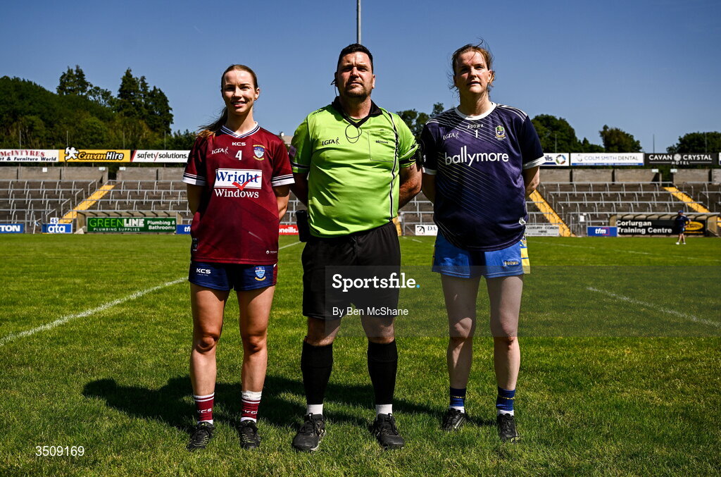 12 July 2026; Referee David Hurson with Westmeath captain Fiona Coyle, left, and Roscommon captain Helena Cummins before before the LGFA TG4 All-Ireland Intermediate Championship semi-final match between Roscommon and Westmeath at Kingspan Breffni in Cavan. Photo by Ben McShane/Sportsfile