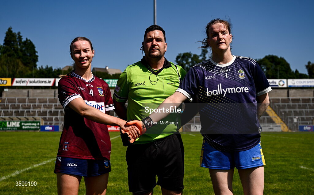 12 July 2026; Referee David Hurson with Westmeath captain Fiona Coyle, left, and Roscommon captain Helena Cummins before before the LGFA TG4 All-Ireland Intermediate Championship semi-final match between Roscommon and Westmeath at Kingspan Breffni in Cavan. Photo by Ben McShane/Sportsfile