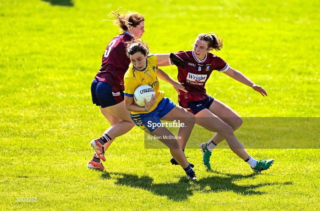 12 July 2026; Roise Lennon of Roscommon in action against Anna Jones, right, and Sarah Murphy of Westmeath during the LGFA TG4 All-Ireland Intermediate Championship semi-final match between Roscommon and Westmeath at Kingspan Breffni in Cavan. Photo by Ben McShane/Sportsfile