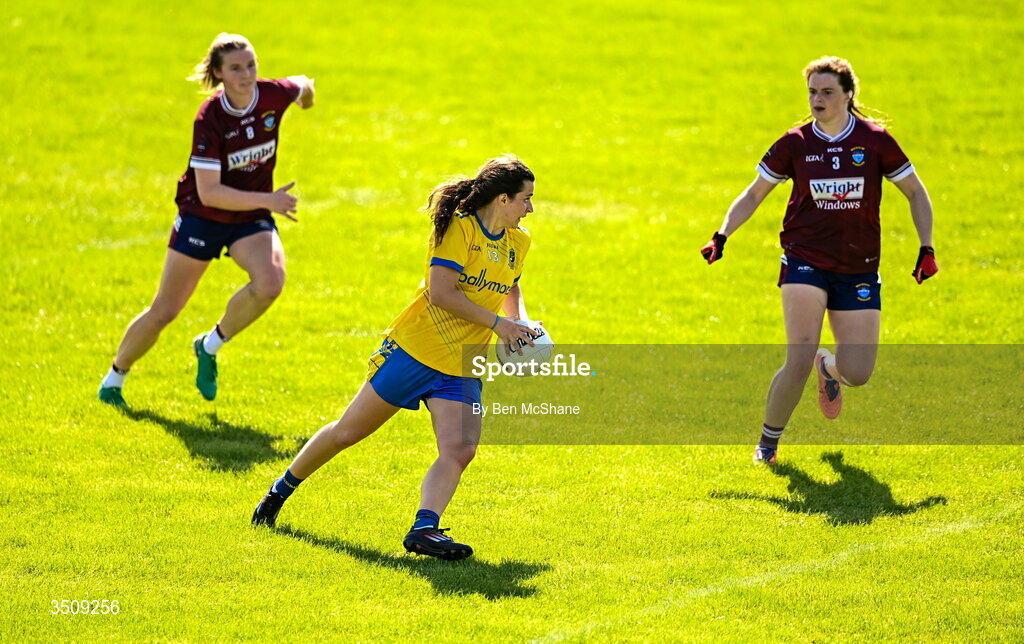 12 July 2026; Roise Lennon of Roscommon in action against Anna Jones, left, and Sarah Murphy of Westmeath during the LGFA TG4 All-Ireland Intermediate Championship semi-final match between Roscommon and Westmeath at Kingspan Breffni in Cavan. Photo by Ben McShane/Sportsfile