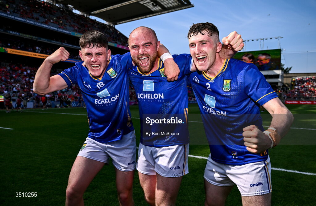 11 July 2026; Wicklow players, from left, Cian Deering, Eoin Murtagh and Tom Moran celebrate after the Tailteann Cup final match between Down and Wicklow at Croke Park in Dublin. Photo by Ben McShane/Sportsfile