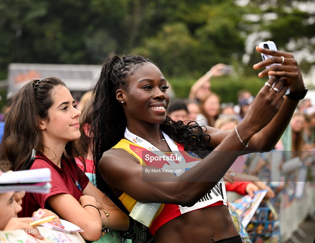 25 July 2026; Rhasidat Adeleke of Tallaght A.C. taking a selfie with a supporter Ruby Craul Keating from Lakeshore Striders AC, Blessington, after her win in the 200m during day one of the 123.ie National Senior Track & Field Championships 2026 at Morton Stadium in Dublin. Photo by Mark Kavanagh/Sportsfile
