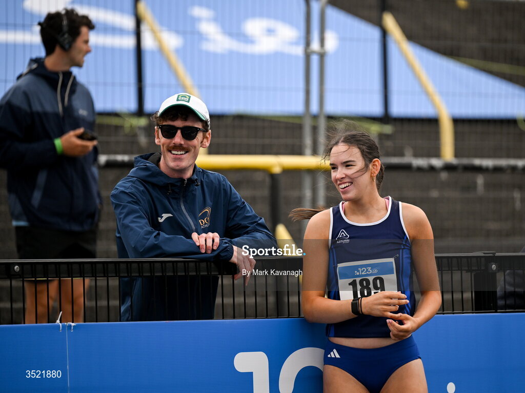 25 July 2026; Emma O'Neill of Carrick-on-Suir A.C. talks with coach and last years indoor long jump champion Colm Bourke after her jump in the long jump during day one of the 123.ie National Senior Track & Field Championships 2026 at Morton Stadium in Dublin. Photo by Mark Kavanagh/Sportsfile