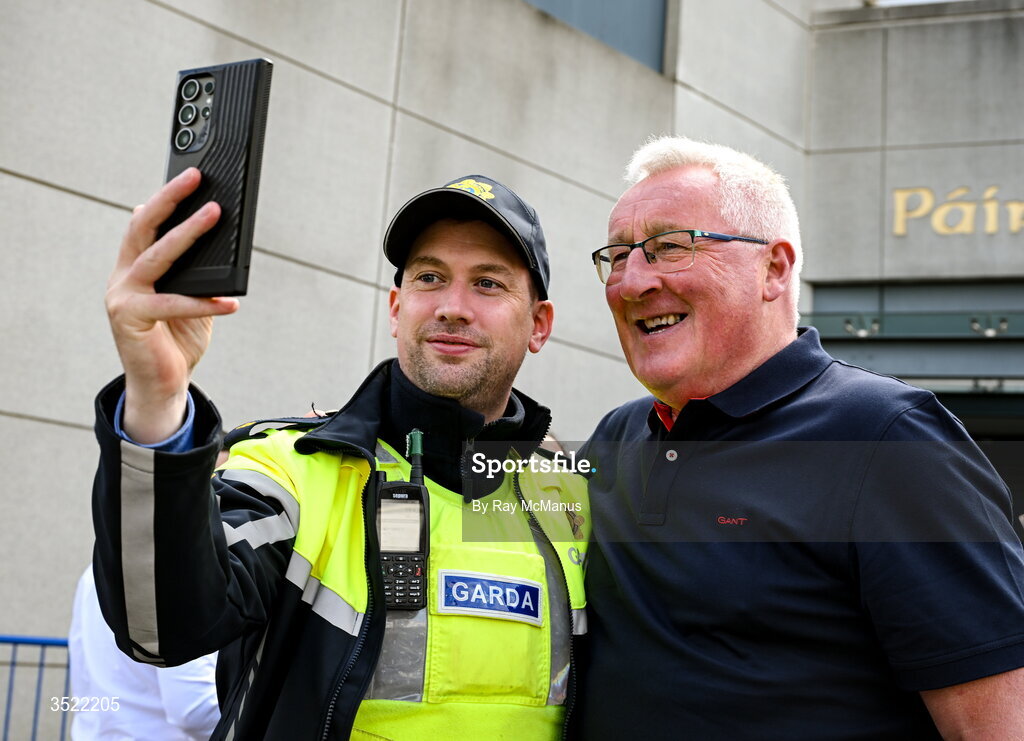 26 July 2026; A Garda poses for a 'selfie' with former Kerry star Pat Spillane, a winner of eight All-Ireland Medals, 12 Munster and 9 All-Star awards, outside Croke Park before the GAA Football All-Ireland Senior Championship final match between Kerry and Mayo at Croke Park in Dublin. Photo by Ray McManus/Sportsfile