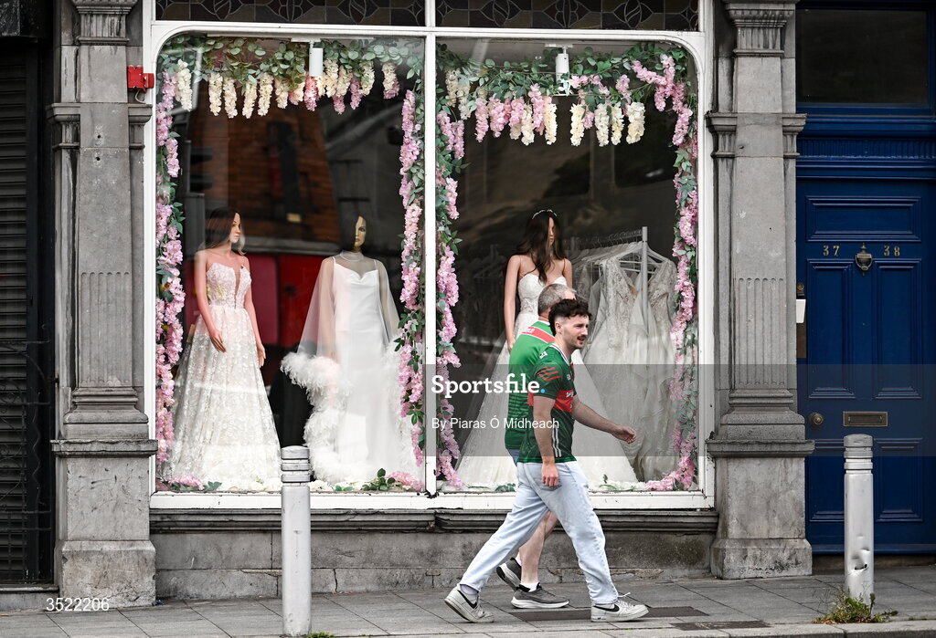 26 July 2026; Mayo supporters walk past a bridal shop before the GAA Football All-Ireland Senior Championship final match between Kerry and Mayo at Croke Park in Dublin. Photo by Piaras Ó Mídheach/Sportsfile