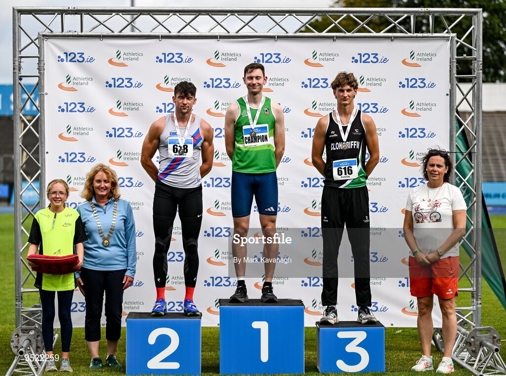 25 July 2026; Men;s high jump presentation from left, Athletics Ireland President Brid Golden, Lorcan Murphy of Dundrum South Dublin A.C., silver, David Cussen of Old Abbey A.C., gold, and Patryk Pucek of Clongriffin A.C., bronze during day one of the 123.ie National Senior Track & Field Championships 2026 at Morton Stadium in Dublin. Photo by Mark Kavanagh/Sportsfile