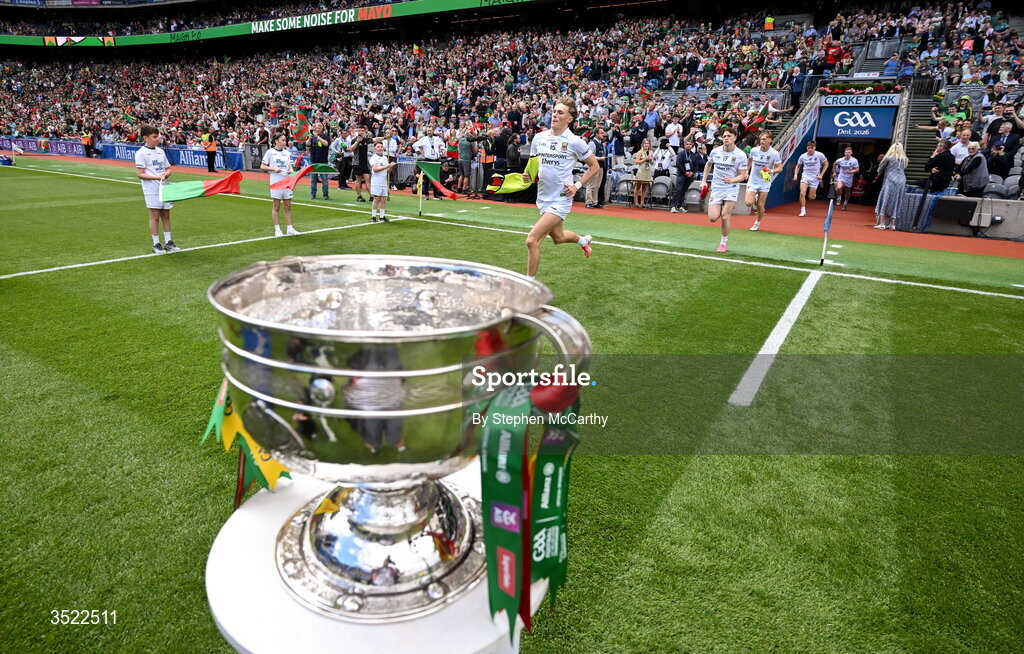 26 July 2026; Mayo players, including Kobe McDonald, centre, run past the Sam Maguire Cup ahead of the GAA Football All-Ireland Senior Championship final match between Kerry and Mayo at Croke Park in Dublin. Photo by Stephen McCarthy/Sportsfile