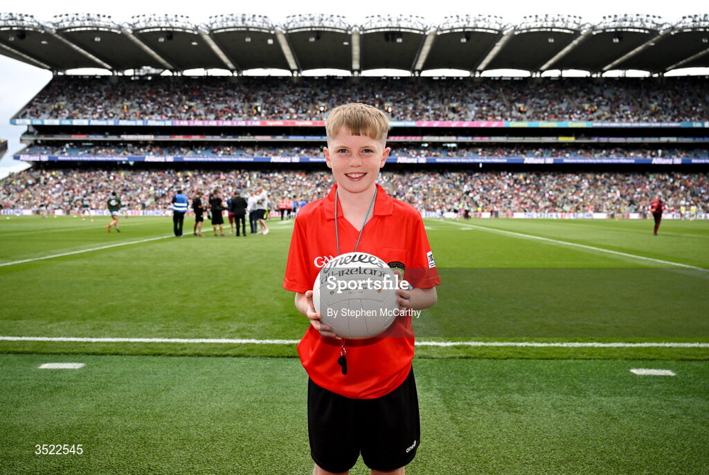 26 July 2026; Darragh Ó Raifeartaigh, aged 12, from Swords in Dublin, before presenting the match ball to referee Martin McNally ahead of the GAA Football All-Ireland Senior Championship final match between Kerry and Mayo at Croke Park in Dublin. Photo by Stephen McCarthy/Sportsfile
