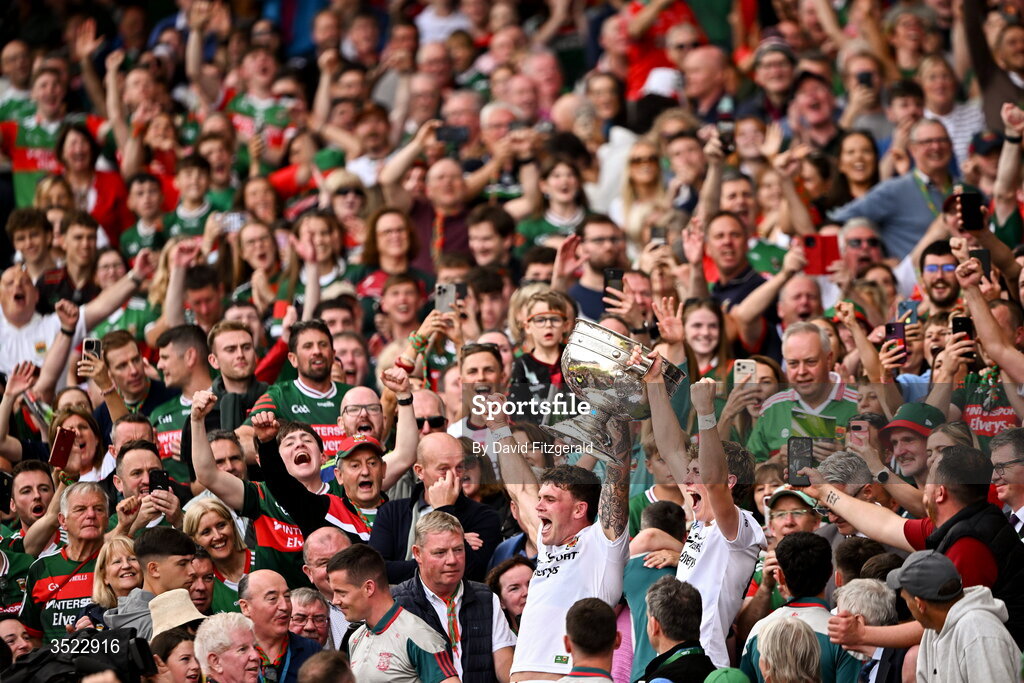 26 July 2026; Mayo players Jordan Flynn, left, and Kobe McDonald lift the Sam Maguire Cup after their side's victory in the GAA Football All-Ireland Senior Championship final match between Kerry and Mayo at Croke Park in Dublin. Photo by David Fitzgerald/Sportsfile