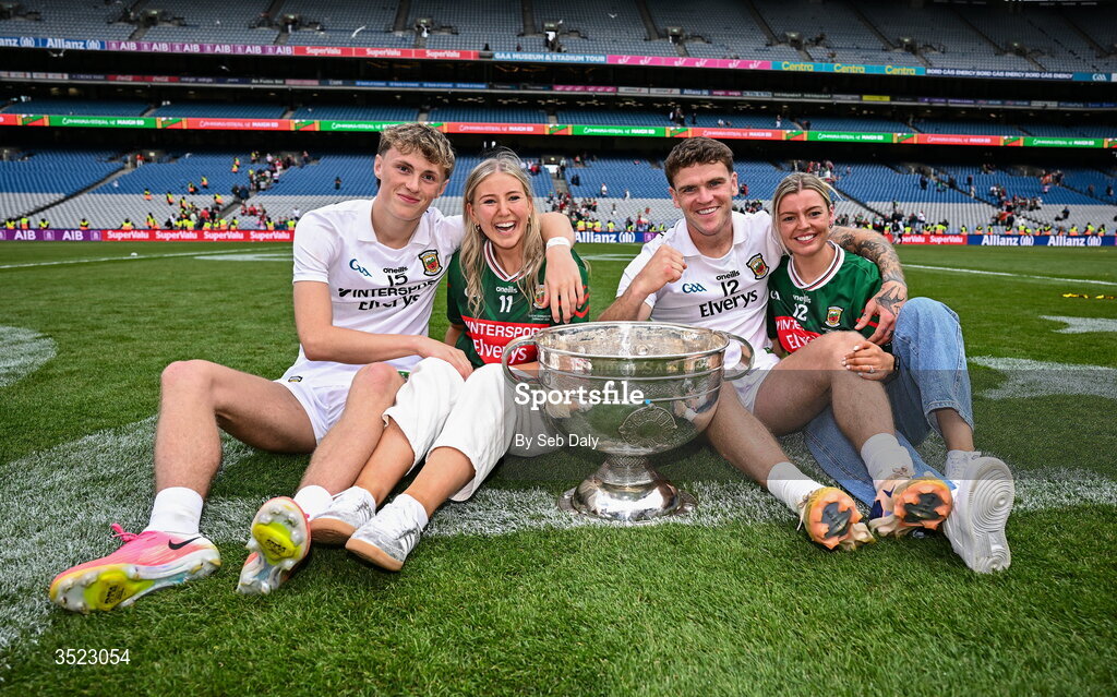 26 July 2026; Mayo players Kobe McDonald, left, and Jordan Flynn with their partners Leah Meheady, second from left, and Jessie Brown, after the GAA Football All-Ireland Senior Championship final match between Kerry and Mayo at Croke Park in Dublin. Photo by Seb Daly/Sportsfile