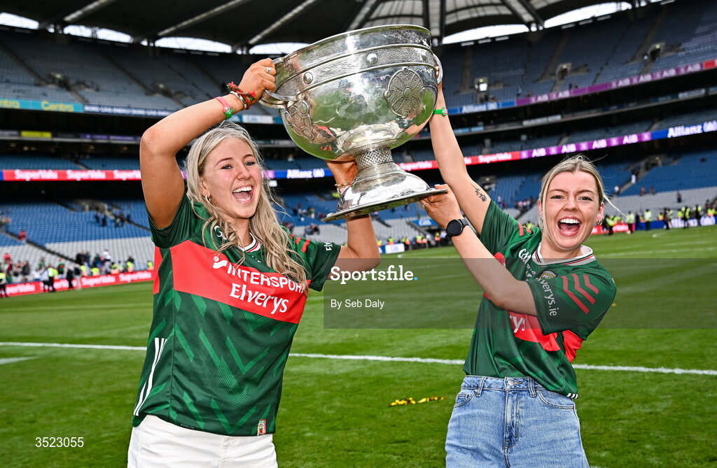 26 July 2026; Leah Maheady, left, partner of Mayo player Kobe McDonald, and Jessie Brown, fiancé of Mayo player Jordan Flynn celebrate with the Sam Maguire Cup after the GAA Football All-Ireland Senior Championship final match between Kerry and Mayo at Croke Park in Dublin. Photo by Seb Daly/Sportsfile