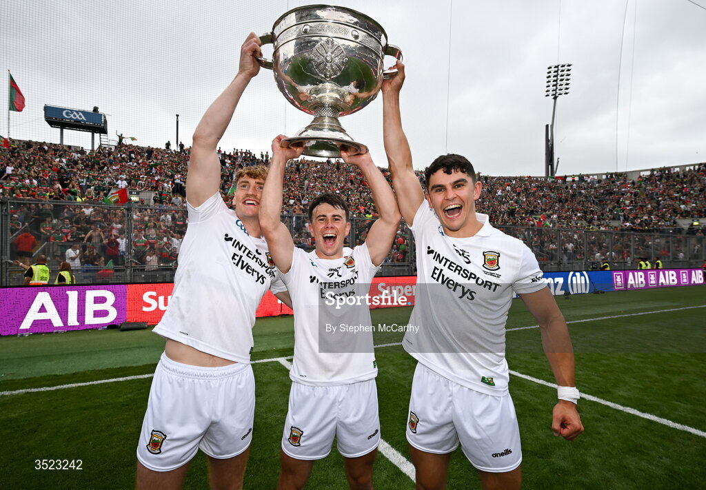 26 July 2026; Mayo players, from left, Jack Carney, Paul Towey and Tommy Conroy celebrate with the Sam Maguire Cup following the GAA Football All-Ireland Senior Championship final match between Kerry and Mayo at Croke Park in Dublin. Photo by Stephen McCarthy/Sportsfile
