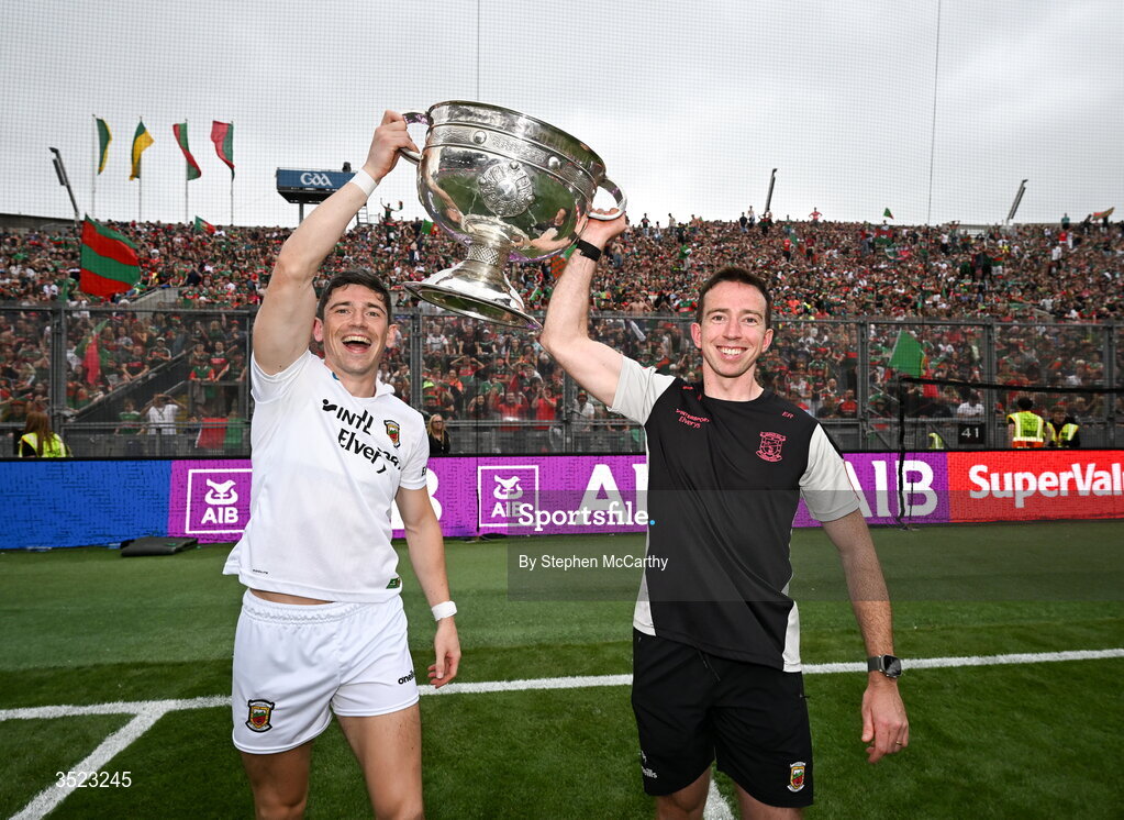 26 July 2026; Mayo's Conor Loftus, left, and nutritionist Evan Regan celebrate with the Sam Maguire Cup following the GAA Football All-Ireland Senior Championship final match between Kerry and Mayo at Croke Park in Dublin. Photo by Stephen McCarthy/Sportsfile