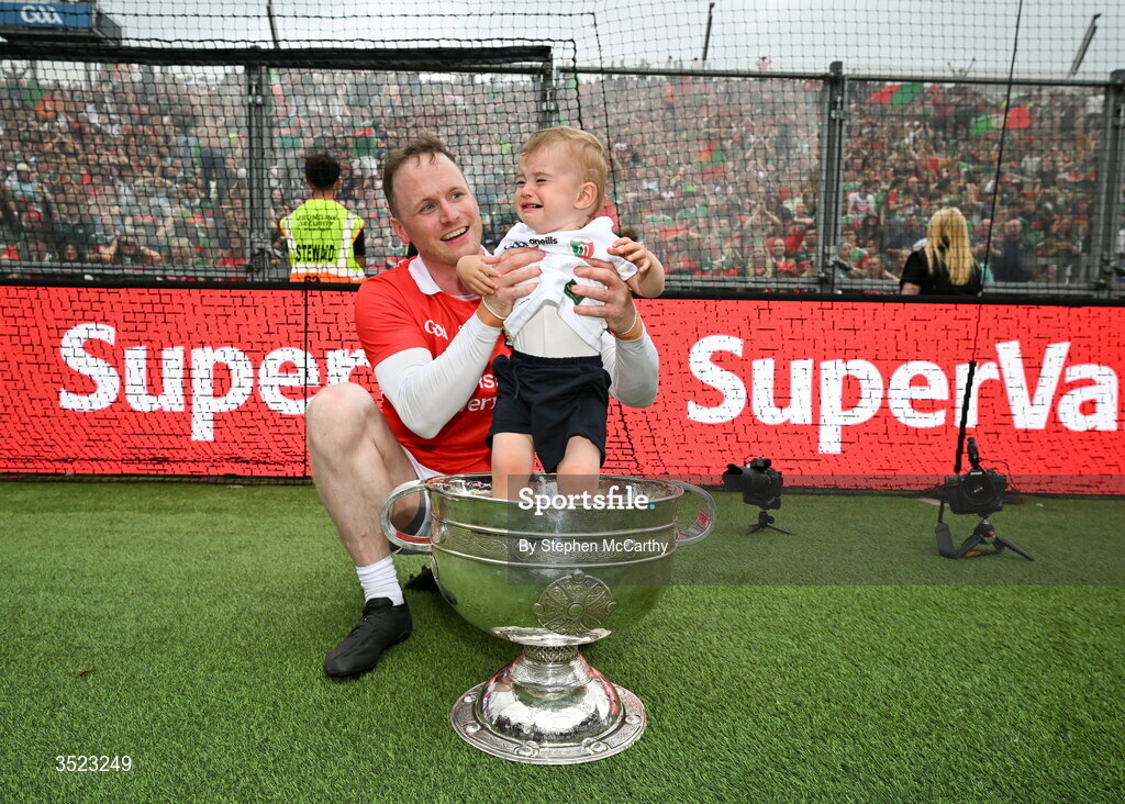 26 July 2026; Mayo goalkeeper Rob Hennelly and his son Billy celebrate with the Sam Maguire Cup following the GAA Football All-Ireland Senior Championship final match between Kerry and Mayo at Croke Park in Dublin. Photo by Stephen McCarthy/Sportsfile