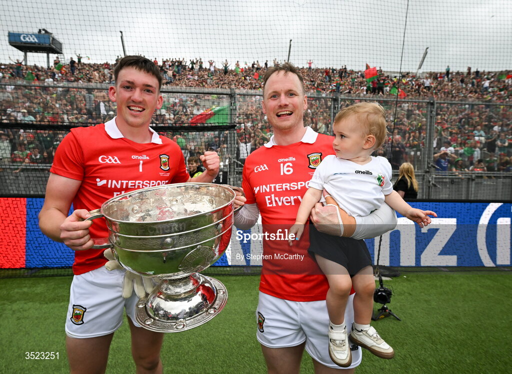 26 July 2026; Mayo goalkeepers Jack Livingstone, left, and Rob Hennelly and his son Billy celebrate with the Sam Maguire Cup following the GAA Football All-Ireland Senior Championship final match between Kerry and Mayo at Croke Park in Dublin. Photo by Stephen McCarthy/Sportsfile