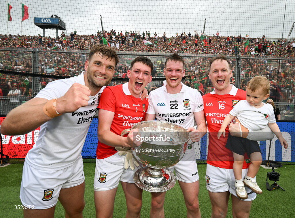 26 July 2026; Mayo players, from left, Aidan O'Shea, Jack Livingstone, Matthew Ruane, Rob Hennelly and his son Billy celebrate with the Sam Maguire Cup following the GAA Football All-Ireland Senior Championship final match between Kerry and Mayo at Croke Park in Dublin. Photo by Stephen McCarthy/Sportsfile