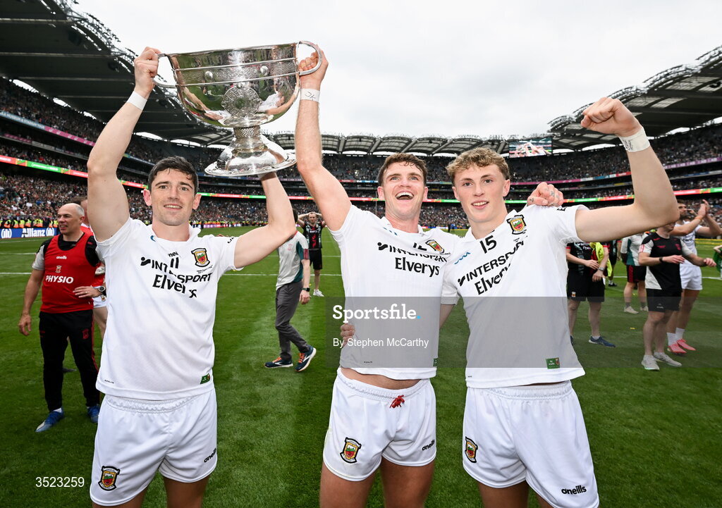 26 July 2026; Mayo players, from left, Conor Loftus, Jordan Flynn and Kobe McDonald celebrate with the Sam Maguire cup after the GAA Football All-Ireland Senior Championship final match between Kerry and Mayo at Croke Park in Dublin. Photo by Stephen McCarthy/Sportsfile