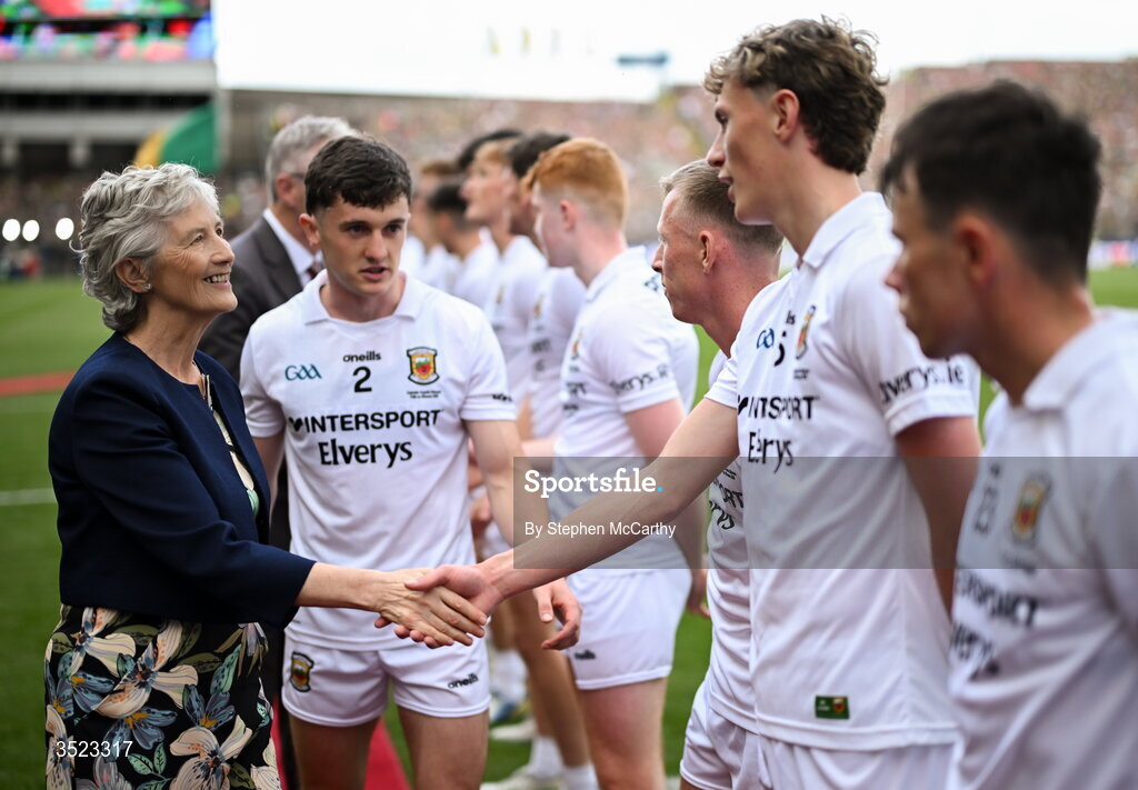 26 July 2026; President of Ireland Catherine Connolly is introduced to Kobe McDonald of Mayo by captain Jack Coyne, 2, before the GAA Football All-Ireland Senior Championship final match between Kerry and Mayo at Croke Park in Dublin. Photo by Stephen McCarthy/Sportsfile