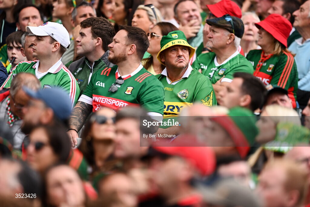 26 July 2026; A dejected Kerry supporter sits among Mayo supporters during the GAA Football All-Ireland Senior Championship final match between Kerry and Mayo at Croke Park in Dublin. Photo by Ben McShane/Sportsfile