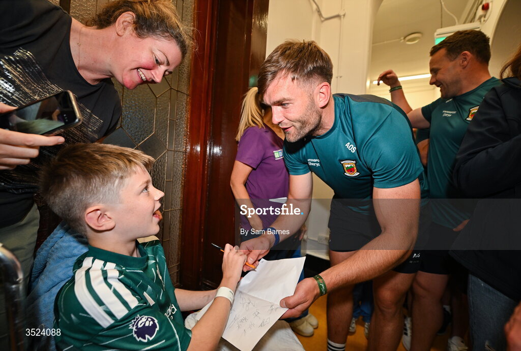 27 July 2026; Aidan O'Shea of Mayo with JP O’Connor, aged 10, at CHI Temple Street in Dublin after being crowned All-Ireland Senior Football champions following their victory over Kerry in the GAA All-Ireland Senior Football Championship final at Croke Park on Sunday. Photo by Sam Barnes/Sportsfile