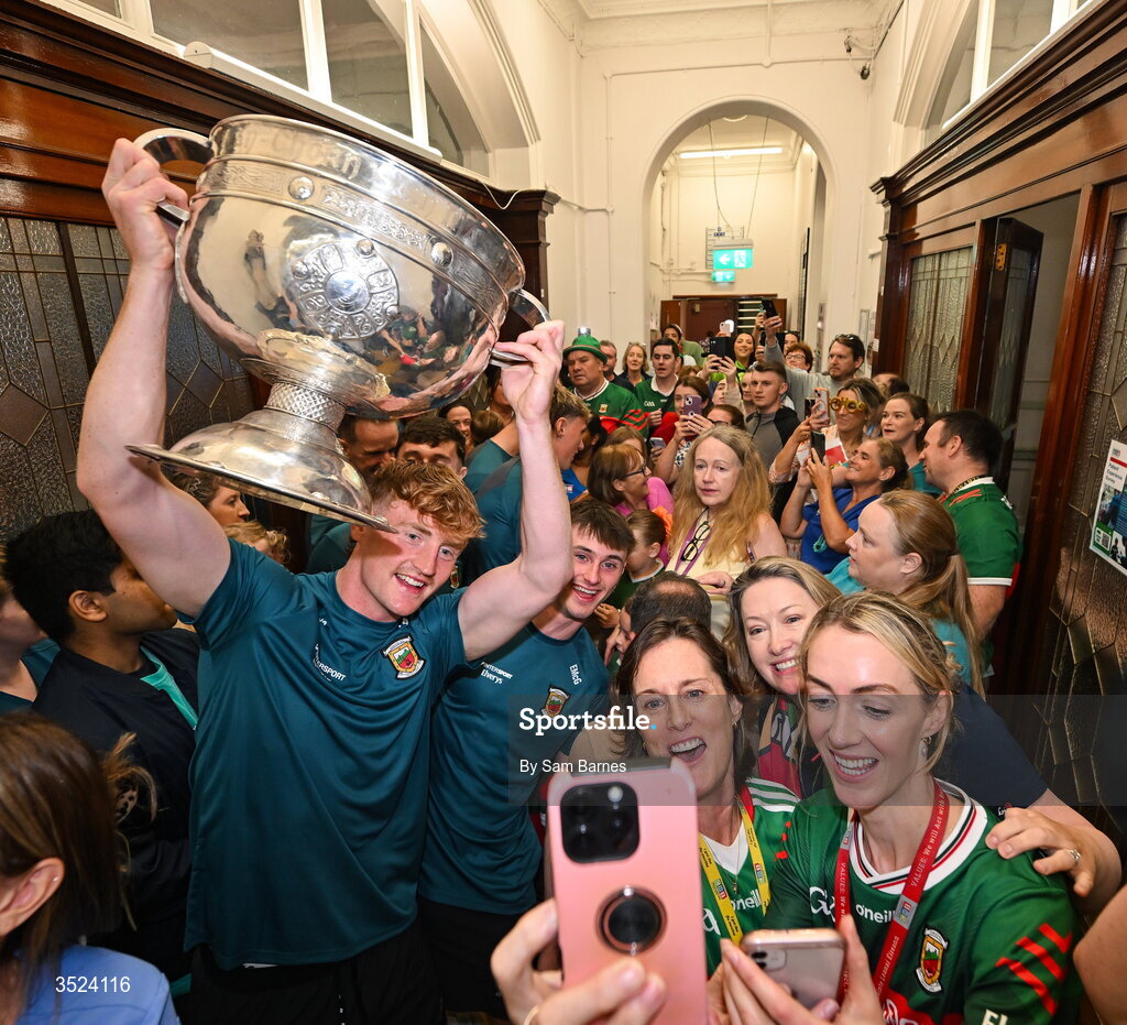 27 July 2026; Jack Carney, left, and Eoin McGreal of Mayo celebrate with supporters at the CHI Temple Street in Dublin after being crowned All-Ireland Senior Football champions following their victory over Kerry in the GAA All-Ireland Senior Football Championship final at Croke Park on Sunday. Photo by Sam Barnes/Sportsfile