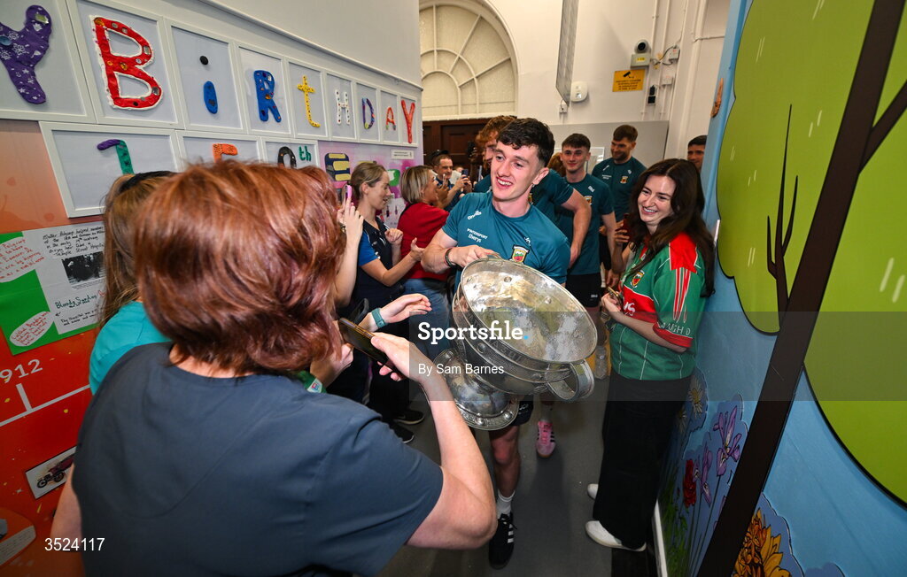 27 July 2026; Jack Coyne of Mayo celebrates with staff at the CHI Temple Street in Dublin after being crowned All-Ireland Senior Football champions following their victory over Kerry in the GAA All-Ireland Senior Football Championship final at Croke Park on Sunday. Photo by Sam Barnes/Sportsfile