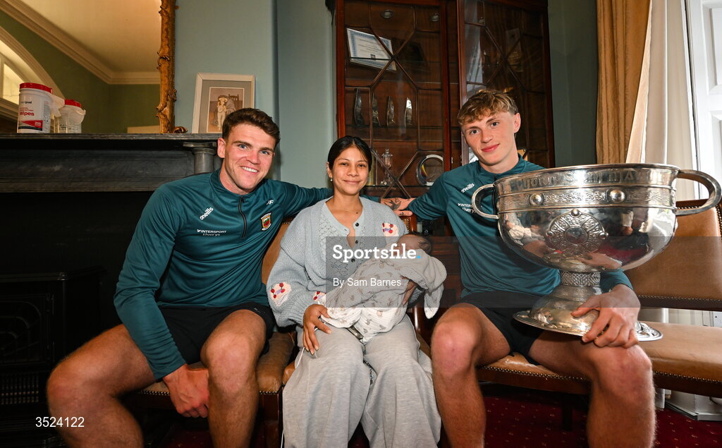 27 July 2026; Jordan Flynn, left, and Kobe McDonald of Mayo with Alicia Linares and Theo Gallagher aged 3 weeks old at CHI Temple Street in Dublin after being crowned All-Ireland Senior Football champions following their victory over Kerry in the GAA All-Ireland Senior Football Championship final at Croke Park on Sunday. Photo by Sam Barnes/Sportsfile