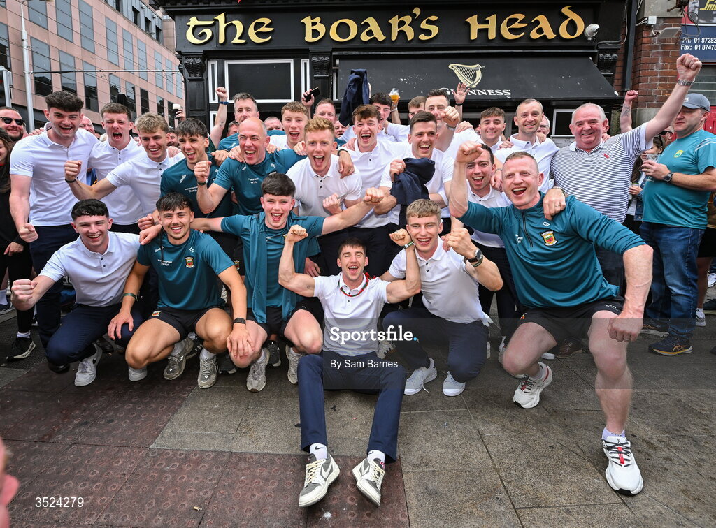 27 July 2026; Mayo players and staff celebrate with the Boar's Head landlord Hugh Hourican, right, at the Boar's Head on Capel Street, Dublin, after being crowned All-Ireland Senior Football champions following their victory over Kerry in the GAA All-Ireland Senior Football Championship final at Croke Park on Sunday. Photo by Sam Barnes/Sportsfile