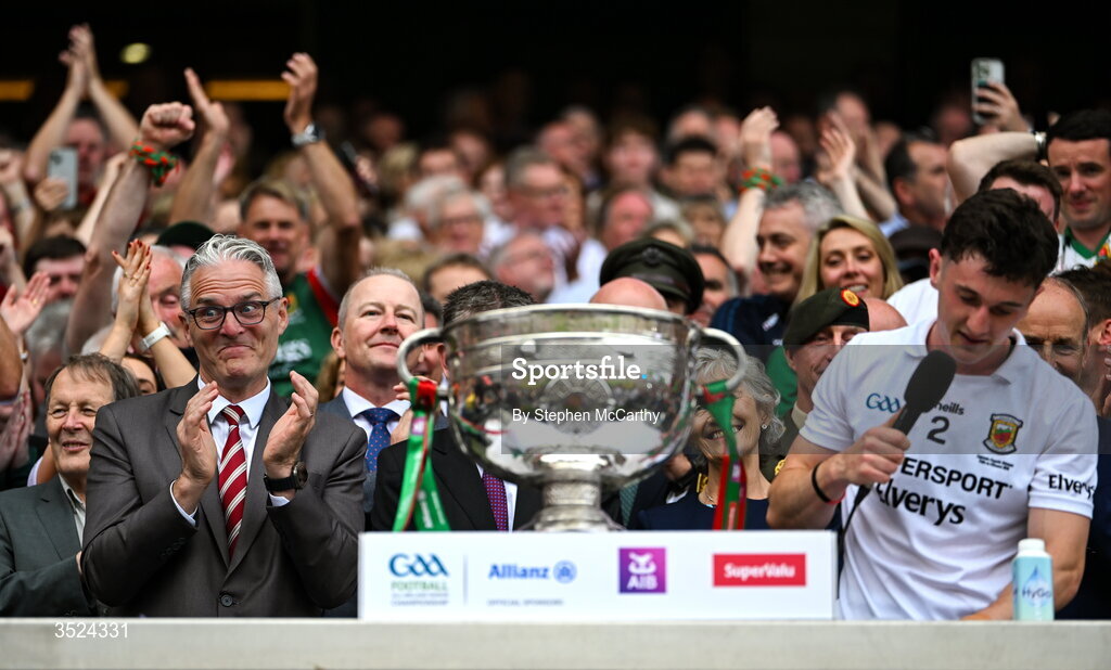 26 July 2026; Uachtarán Chumann Lúthchleas Gael Jarlath Burns reacts as Mayo captain Jack Coyne makes a speech followingthe GAA Football All-Ireland Senior Championship final match between Kerry and Mayo at Croke Park in Dublin. Photo by Stephen McCarthy/Sportsfile