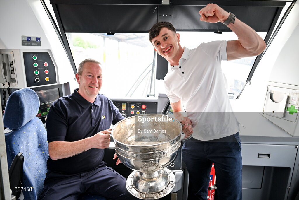 27 July 2026; Jack Coyne of Mayo and train driver Anthony O’Reardon celebrate with the Sam Maguire Cup at Heuston Station in Dublin after being crowned All-Ireland Senior Football champions following their victory over Kerry in the GAA All-Ireland Senior Football Championship final at Croke Park on Sunday.  Photo by Sam Barnes/Sportsfile