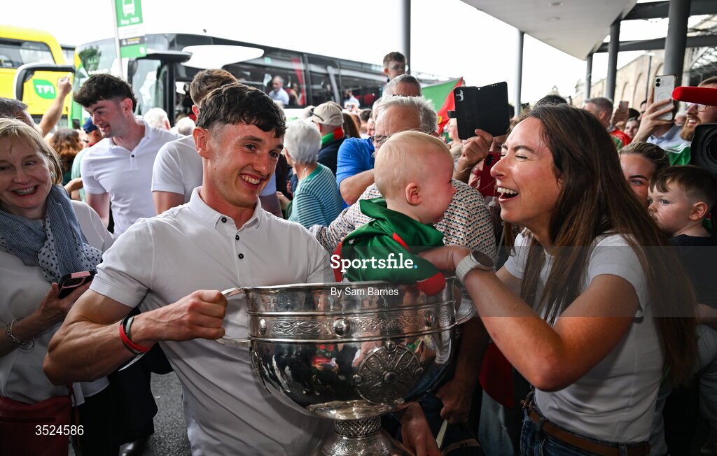 27 July 2026; Jack Coyne of Mayo celebrates with supporters and the Sam Maguire Cup at Heuston Station in Dublin after being crowned All-Ireland Senior Football champions following their victory over Kerry in the GAA All-Ireland Senior Football Championship final at Croke Park on Sunday. Photo by Sam Barnes/Sportsfile