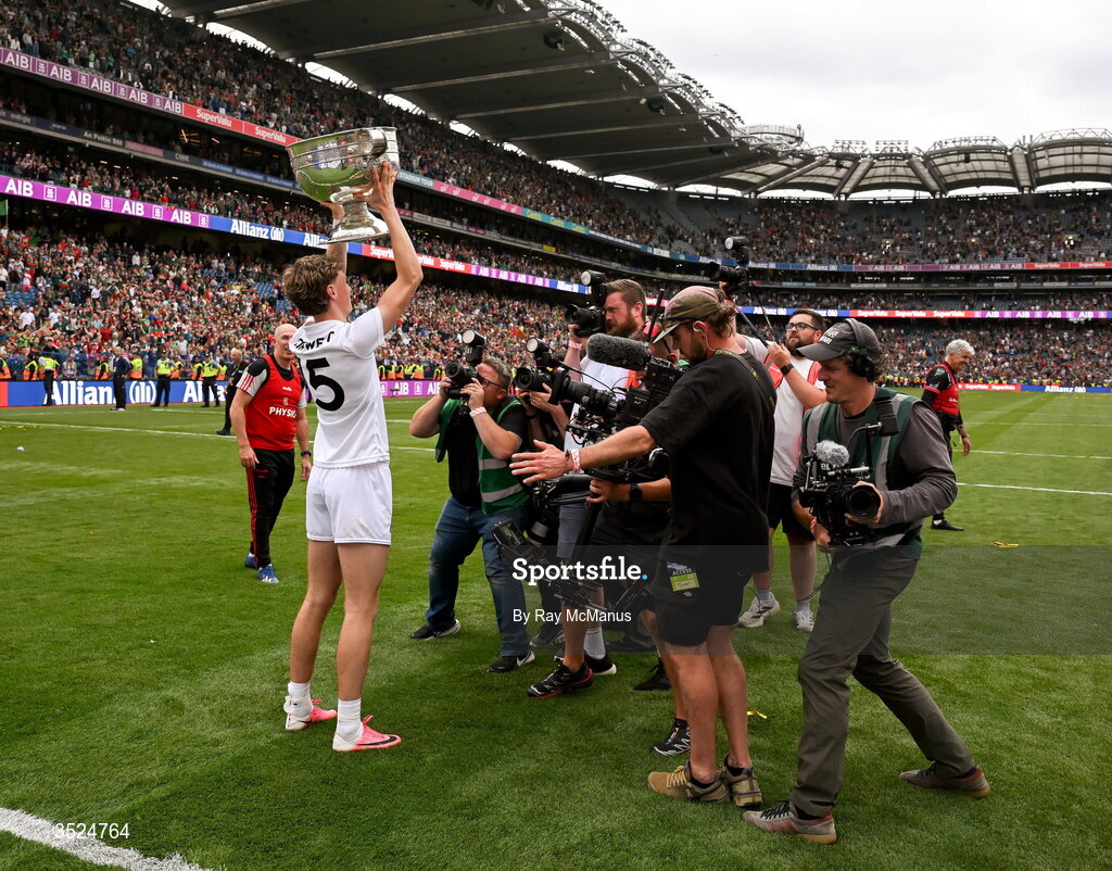 26 July 2026; Kobe McDonald of Mayo is surrounded by photographers and TV crews as he holds the Sam Maguire aloft after the GAA Football All-Ireland Senior Championship final match between Kerry and Mayo at Croke Park in Dublin. Photo by Ray McManus/Sportsfile